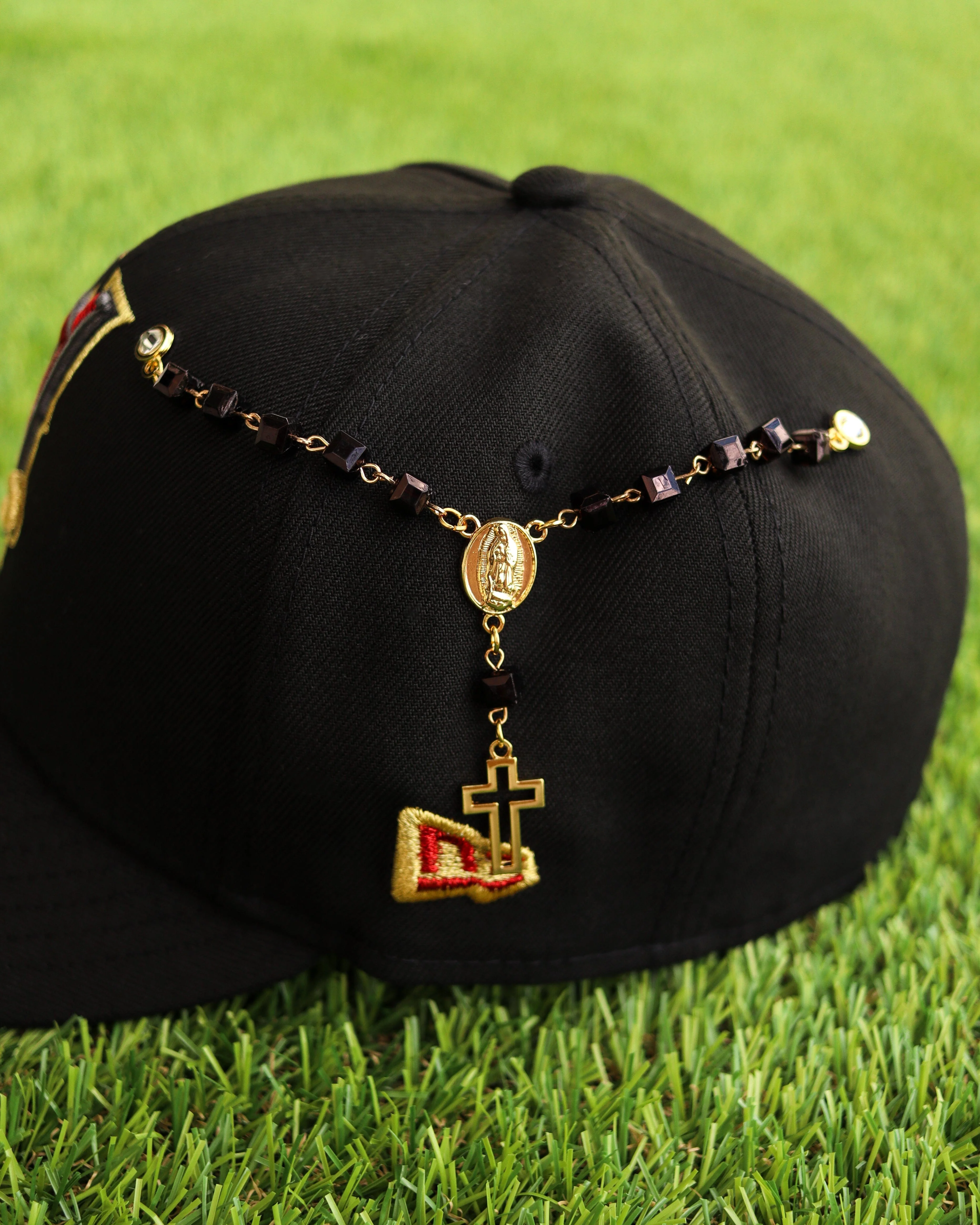 Black rosary pin